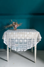 Round vintage white crochet tablecloth