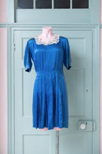 Vintage 1940s blue satin dress with white lace collar
