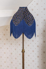 Vintage handmade brass standing lamp with blue fringe lampshade