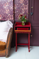 Antique red velvet console table with fringe