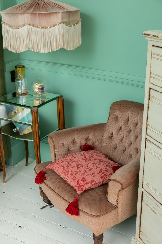 Vintage red cushion with red tassels