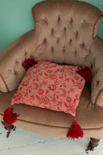 Vintage red cushion with red tassels