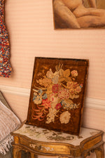 Antique velvet floral picture on wooden board