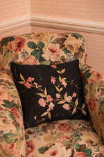 Antique black floral cushion