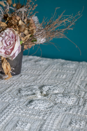 Round vintage white crochet tablecloth