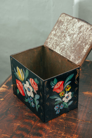 Antique black floral tin