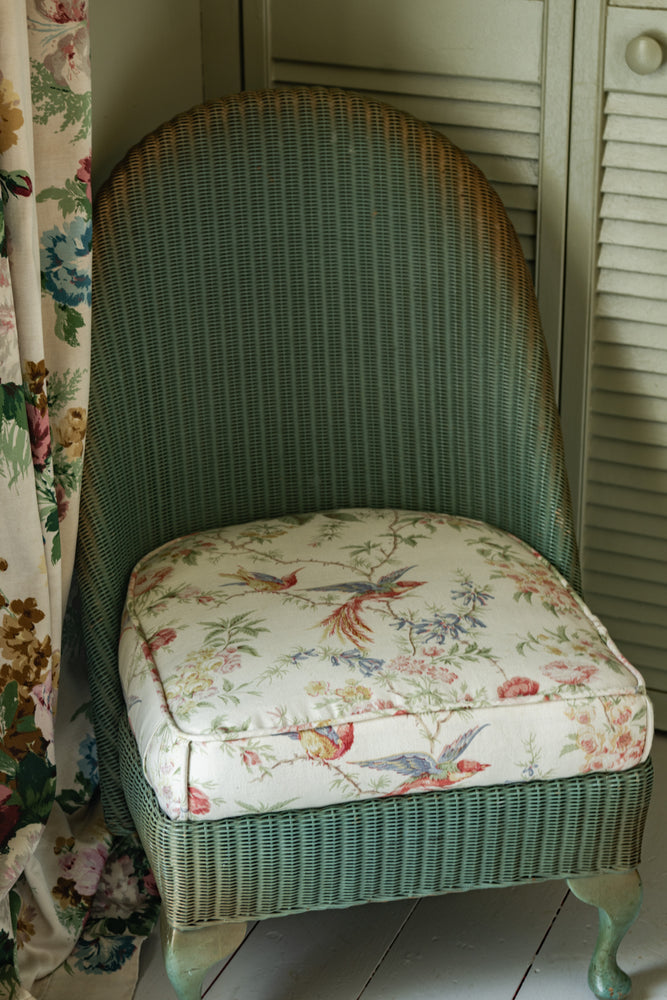 Sweet antique Lloyd loom wicker chair with floral seat