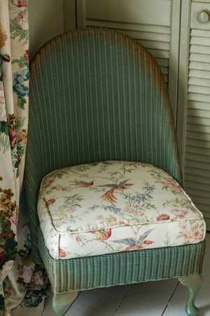 Sweet antique Lloyd loom wicker chair with floral seat