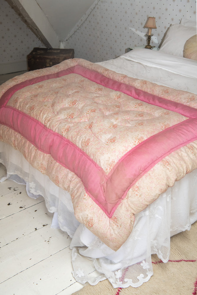 Antique pink floral quilt