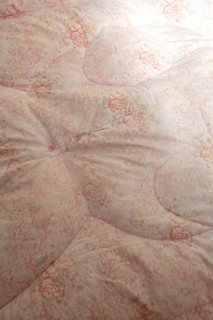 Antique pink floral quilt