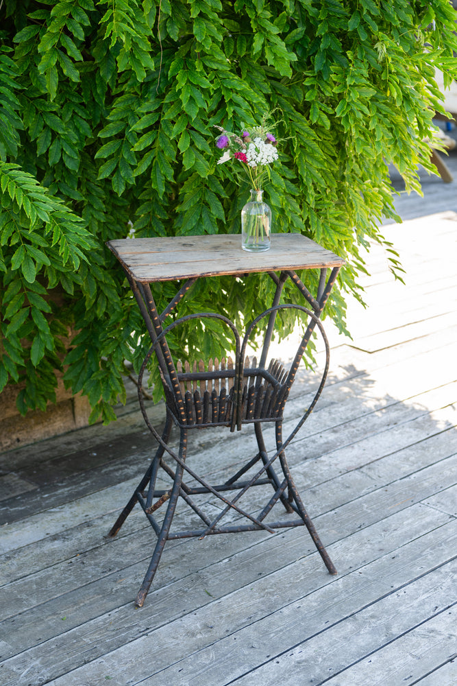 Antique wooden garden table with metal heart