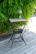 Antique wooden garden table with metal heart