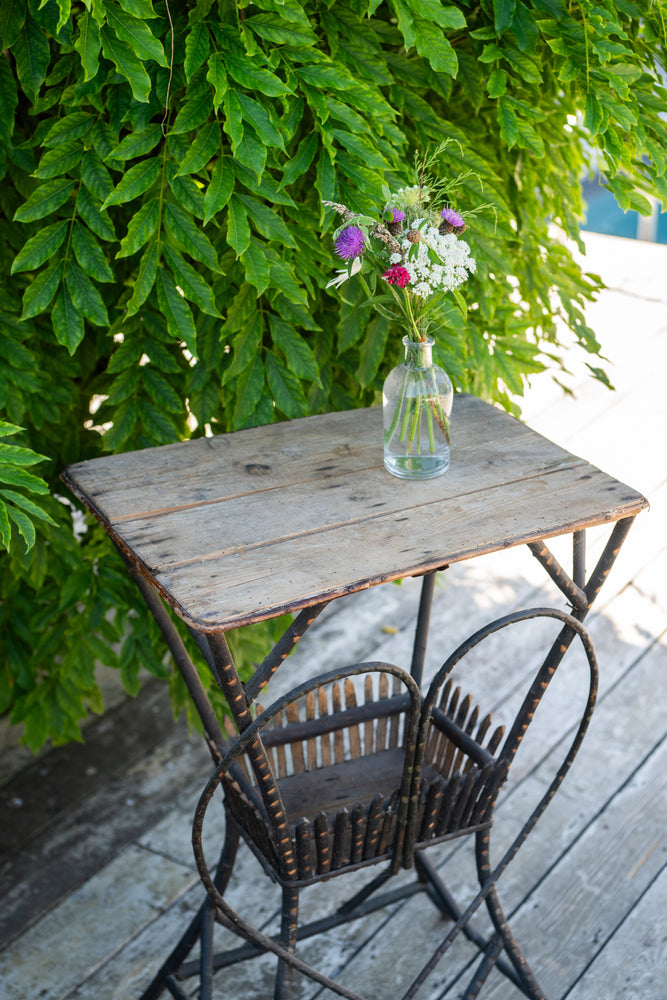 Antique wooden garden table with metal heart
