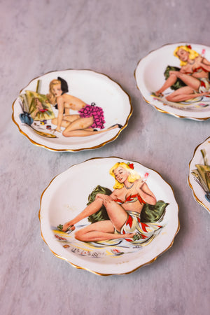 A set of 4 pin-up plates