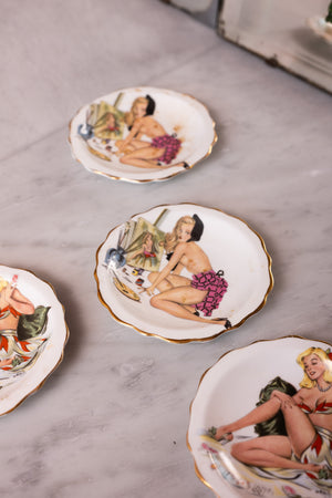 A set of 4 pin-up plates