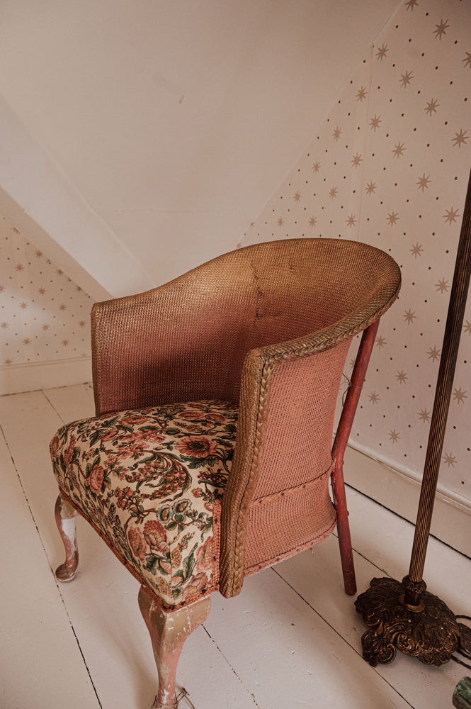Vintage pink Lloyd Loom chair