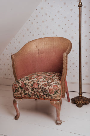 Vintage pink Lloyd Loom chair