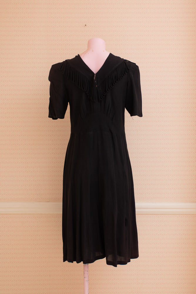 Original black crepe short sleeve dress with fringe collar