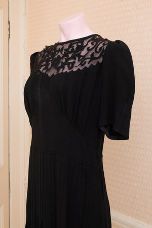 Damaged and discoloured black crepe original 40s dress