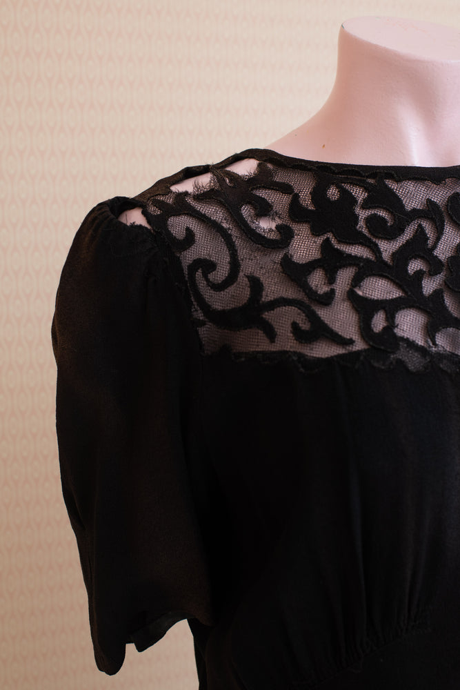 Damaged and discoloured black crepe original 40s dress