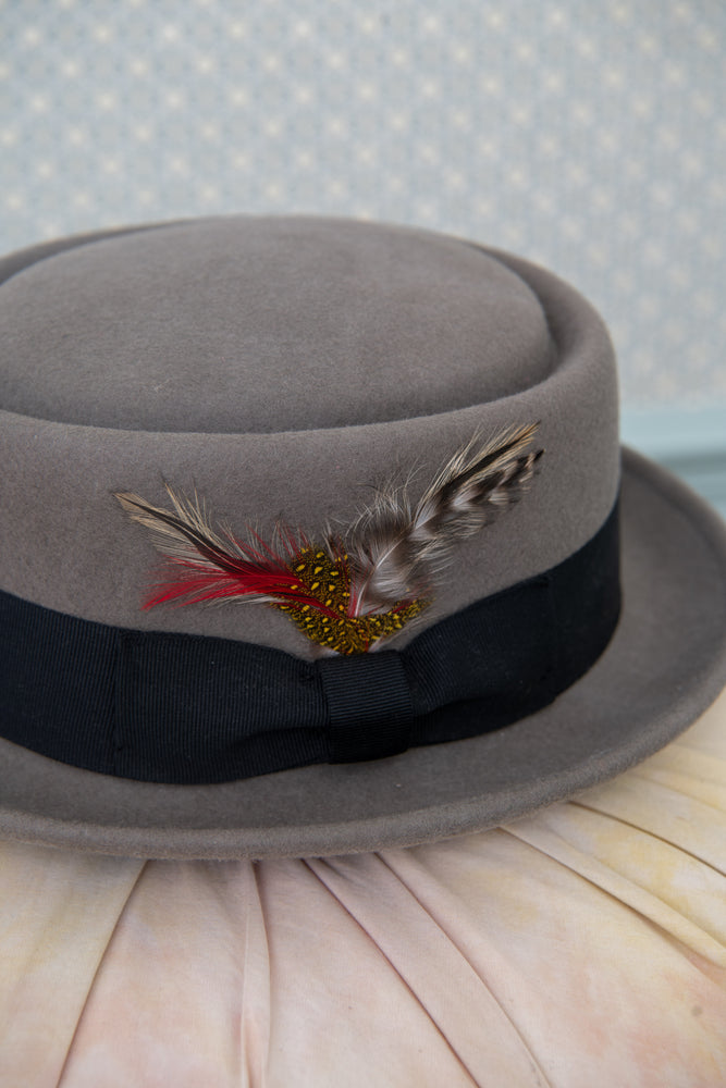 Vintage grey felt hat with feather