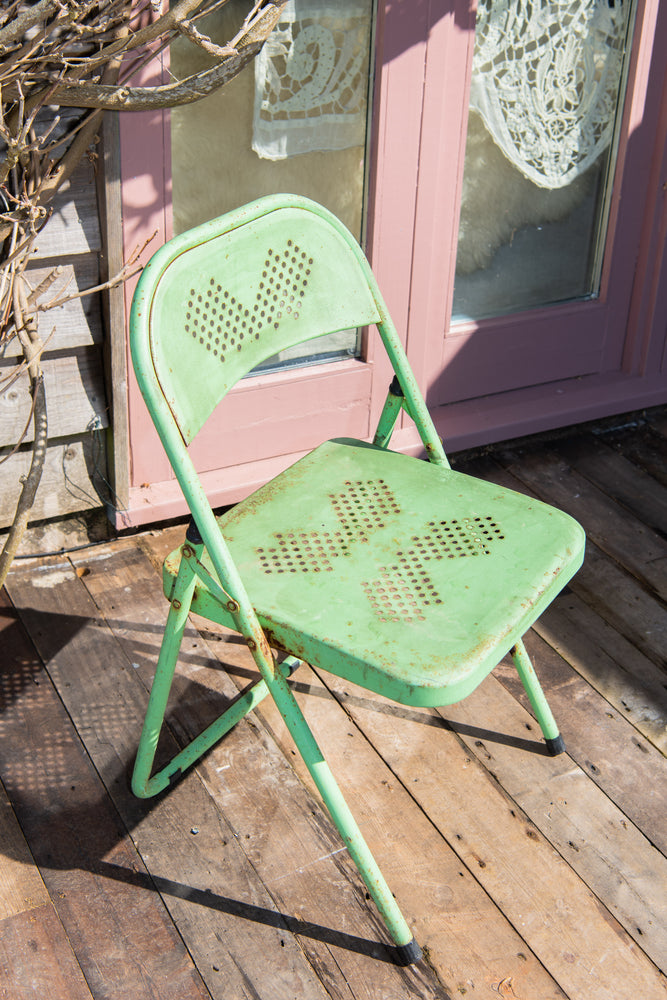 Green metal outlet folding chairs