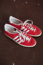 Red suede Addidas trainers
